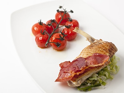 Grilled Guinea Fowl Breast with Roasted Vine Tomatoes And Crispy Ham